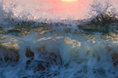 Backlit surf at sunset